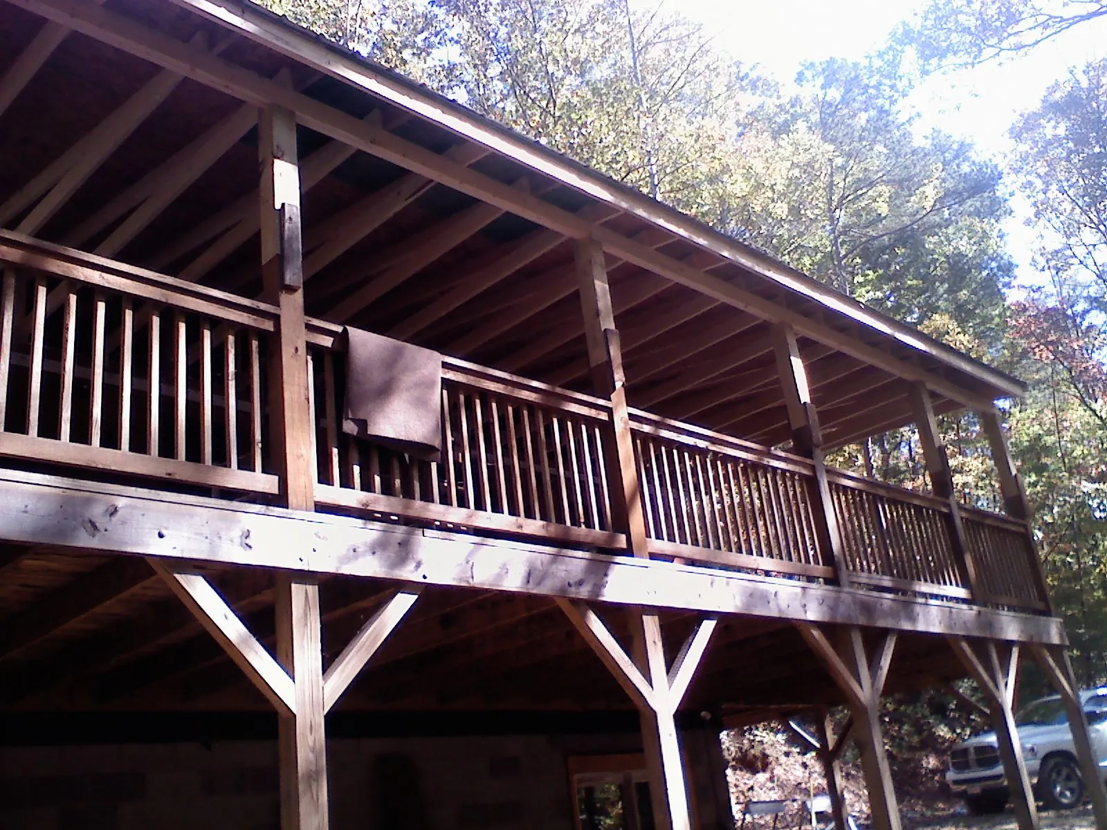 Timber framing under a new elevated porch and deck — Roof Leak Repair in Scandinavia by Roofing Brothers